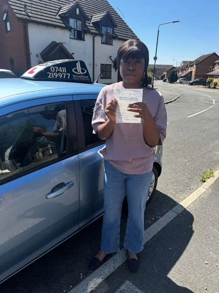 Josephine with their driving test pass certificate