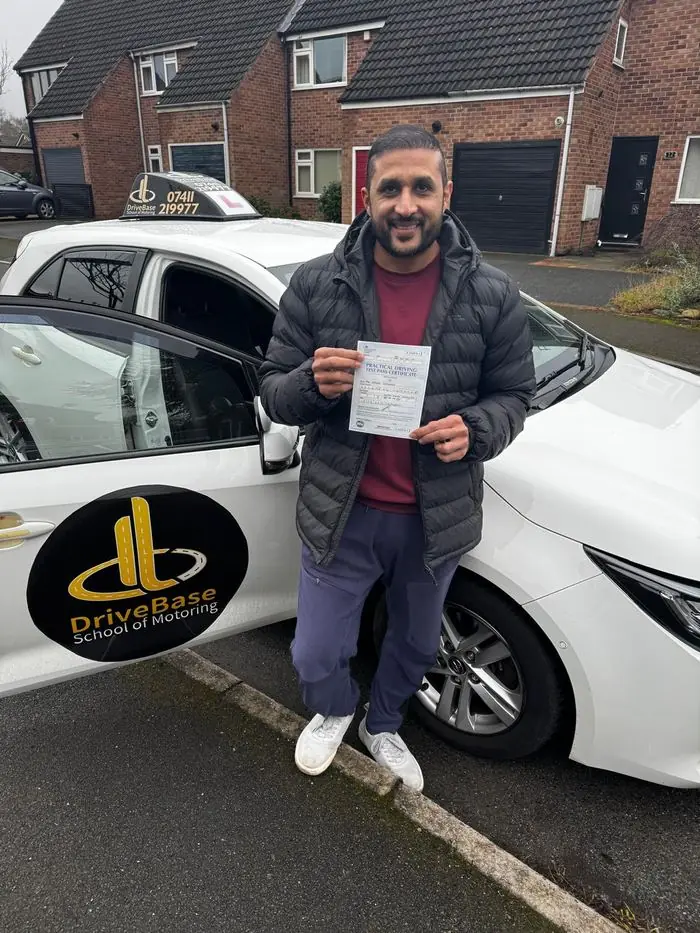 Yasir with their driving test pass certificate